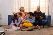 © SKW - A happy ASEAN family living together as a big family is together in the living room at home, and behind is a sofa.