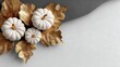 © John - White pumpkins with golden leaves on elegant textured background, modern minimalist autumn seasonal decoration concept for festive Thanksgiving designs