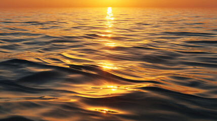Wall Mural - Serene ocean waves reflect golden hues of sunset, creating tranquil and picturesque scene. gentle ripples and warm colors evoke sense of peace and beauty