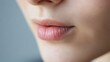 © Metthaisonk - Close-up of soft and natural lips, showcasing smooth skin and subtle detail in natural lighting.