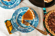 © PICHA - Homemade pecan and pumpkin pie desserts served at holiday dinner table