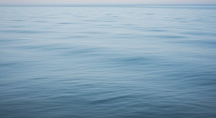 Wall Mural - Serene Ocean Surface: Subtle Waves, Tranquil Blue Hues, Minimalist Seascape
