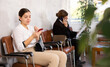 © JackF - Unemployed young woman sits and waits for invitation to interview. Bored woman candidate with smartphone waiting for invitation to recruiter office