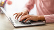 © Prostock-studio - People and technology concept. African american teen girl typing on laptop keyboard, schooling during coronavirus pandemic, studying online at home, closeup, crop