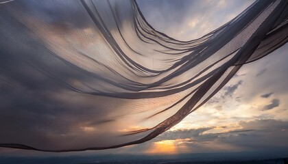 Wall Mural - flowing sheer fabric against a dramatic grey sky creating a dynamic and ethereal atmosphere for creative and artistic themes