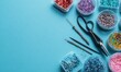 © AndiAzis - Colorful beads and jewelry-making tools arranged on a vibrant blue background for craft and accessory design