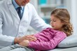 © TuruMuru - Doctor performs abdominal examination on a young girl