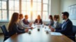 © saranya - blurred photo of business people sitting around the table in an office, captured from behind and in focus, symbolizing collaboration within company or between different quaint style icons.