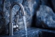 © andyaziz6 - Close-up of a modern outdoor faucet with flowing water over a stone basin in a natural setting