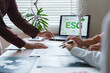 © Phimwilai - Business people discussing esg environmental social governance investment concept
