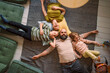 © TrueShot | Westend61 - Family sleeping together on carpet at home