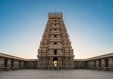 Magnificent ancient hindu temple tower against clear blue sky in tamil nadu, india
