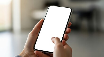 Hands holding smartphone with blank white screen