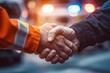 © AlAfiq - Handshake Between Two Individuals in Public Safety Situation at Night