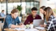 © N7 - Young creative professionals gathered at office table — collaborating on fresh business ideas