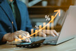 © Ei - Interest rate concept, Business man using calculator with graph percentage symbol and up arrow, Growth of investments and profits, Dividends and long term investing to win Inflation, Calculate taxes