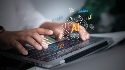 Artificial intelligence, machine learning, and data analysis in modern business or future technology, innovation. Man hands typing on a laptop keyboard, with a glowing AI brain graphic on the screen.