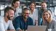 © buraratn - Collaborative team working together in modern office environment, sharing ideas and enjoying productive moment. atmosphere is positive and engaging, highlighting teamwork and creativity