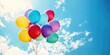 © Mann - Colorful balloons flying in the sky on a sunny day. Birthday party concept.
