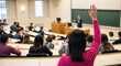 © Graphic Dude - Student Raising Hand to Ask Question in University Lecture Hall