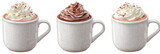 Three cups of hot chocolate, topped with whipped cream and cocoa sprinkles