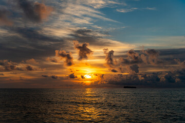 Wall Mural - Skyscape with sea sunrise. Peaceful horizon at sea nature. Romantic summer vacation on beach seascape. Sunrise sky horizon. Sea sunset view. Cloudy sunset sky and seascape at summer vacation