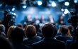 © TyliJura - audience listens to speakers at conference event