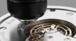 © Kostiantyn - Close-up of mechanical watch movement under loupe