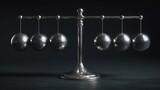 Metallic Newton's cradle; six spheres suspended, demonstrating momentum. Silver, physics concept