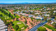 Aerial Las Vegas Residential Golf Course Community With Distant Strip Skyline