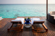 © Mat Rick Photography - table and chairs on the terrace at a resort in the Maldives