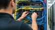 © Alan - IT Engineer Installing and Managing Network Cables in a Server Rack for Data Center Connectivity and Infrastructure Maintenance