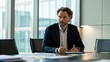 © Johnnii - A focused man in a suit sits at a modern conference table, surrounded by papers and notes, with large windows providing a bright, professional atmosphere.