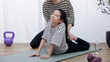 © DN6 - A mother is training her daughter, A mother guides her cheerful daughter through a stretching routine at home, exercising for a healthy lifestyle concept