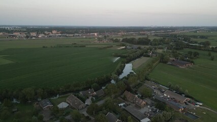 Wall Mural - countryside landscape with fields and small township in belgium, aerial view