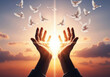 © Shafiqul Islam - Hands releasing white doves into a bright sunrise symbolizing hope peace freedom and spirituality