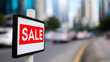 © Curioso.Photography - Red SALE sign by a busy urban street with cars and skyscrapers in the background.