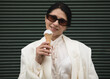© Erika - Woman, eating ice cream. Happy woman. Summer day. Fashion photo. Portrait.