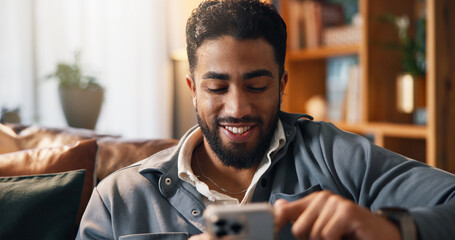 Happy, phone and man on sofa for social media, online connection and text message on weekend. Living room, relaxing and person typing on smartphone for website, contact and communication in home