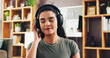 © peopleimages.com - Relax, calm and headphones with woman in home for streaming service, wellness podcast and mindset. Zen audio, meditation guide and peace sound with person in living room of apartment for music