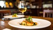 © Yelloone - A beautifully plated seafood dish garnished with greens, served alongside a glass of white wine, set in a cozy dining atmosphere.