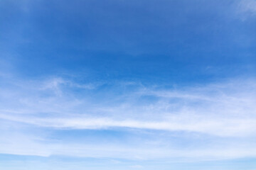 Wall Mural - blue sky background and white clouds soft focus, and copy space horizontal shape.