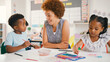 © Monkey Business - Female Teacher With Multi-Cultural Elementary School Pupils In Art Class