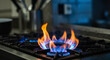 © bastet - Gas stove flame burning brightly in modern kitchen environment