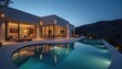 © Pete - Modern luxury home features stunning infinity pool at twilight. Elegant exterior design, landscaped grounds, illuminated patio create perfect entertaining outdoor living space. Mountain backdrop