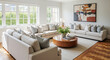 © Владимир Platon - A luxurious and spacious living room with multiple modern sofas arranged for conversation. The room is bright and filled with natural light from a wall of large windows