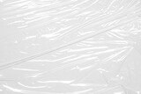 plastic overlay texture of realistic crumpled transparent plastic film wrap on white background,wrinkled stretched plastic effect.abstract plastic background on transparent png