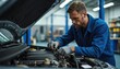 © Pete - Pro mechanic intently repairs car engine in clean workshop. Skilled technician with ratchet tool wears blue workwear and gloves. Focus on automotive maintenance and skilled trades.