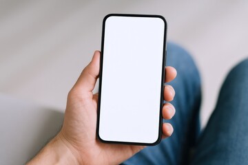 Man Holding Smartphone with Blank White Screen for Mockup or Advertising Display While Relaxing
