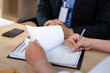 © Natee Meepian - Insurance Agent Explaining Policy Terms to Client. Business meeting focused on clarity.